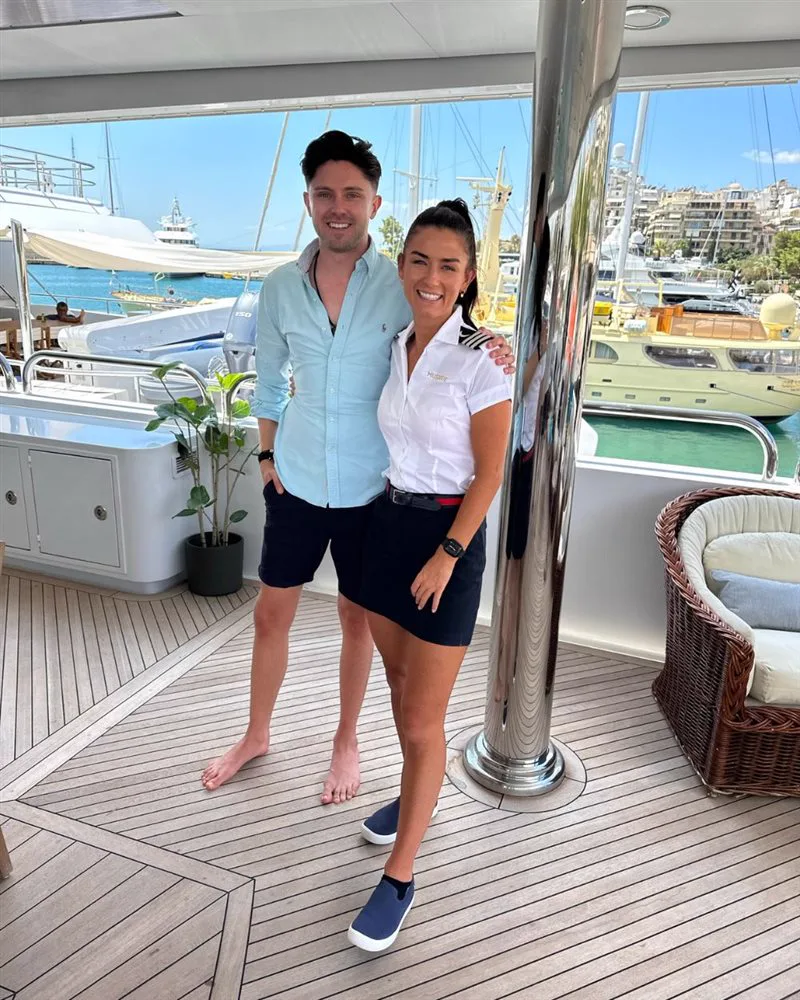 Simon Crowther aboard a yacht with a Below Deck cast member